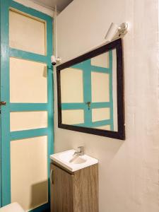 a bathroom with a sink and a mirror at Hotel Casa Rosario in Circasia +34 photos