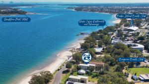 an aerial view of a beach and the ocean at Great Views, Ground Floor Unit in Bongaree
