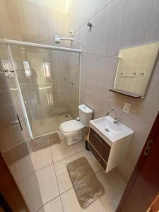 a bathroom with a shower and a toilet and a sink at Galante in Toledo