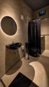 a bathroom with a sink and a toilet at Hotel Boutique Urban in San Gil +9 photos