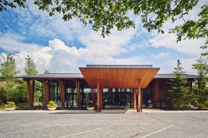 a large building with a wooden pavilion at Hotel Indigo Karuizawa by IHG in Karuizawa