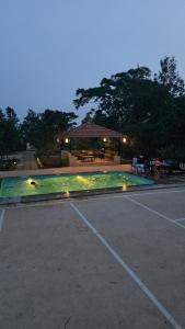 an empty parking lot with a building in the background at Peony By Dhiya in Jadgenhalli