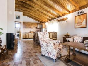 a living room with a couch and a table at Three bedroom Vila with Pool in Stankovci