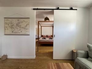 a living room with a door leading to a bedroom at Les Kaz de Sainte Anne in Sainte-Anne +73 photos