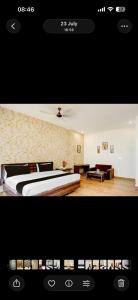 a picture of a hotel room with a bed at Raj Embassy in Rudrapur +1 photo