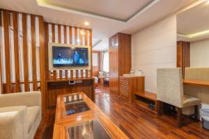 a living room with a couch and a table and a tv at Hotel Dreams Connect GRB 2 in Kathmandu