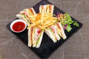 a black plate with sandwiches and french fries andetchup at Hotel Dreams Connect GRB 2 in Kathmandu +52 photos