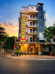 a building with a sign on the side of it at Trung Hậu Hotel Côn Đảo in Con Dao