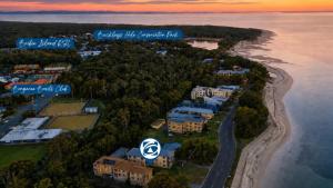 an aerial view of a house on a island in the water at Great Views, Ground Floor Unit in Bongaree