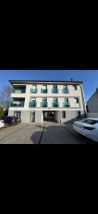 a large white building with a lot of windows at Luxiva Home in Nyíregyháza