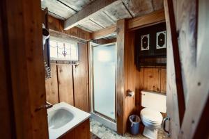 a bathroom with a sink and a toilet and a window at Turn On Inn in Lake Village +80 photos