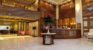 a lobby with a table in the middle of a building at Au Lac 2 Hotel in Ho Chi Minh City
