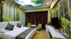 a hotel room with a bed and a large window at Dali Dayu Hotel in Dali
