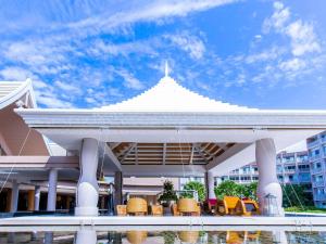 a white pavilion with chairs and tables on a building at Grand Mercure Phuket Patong in Patong Beach