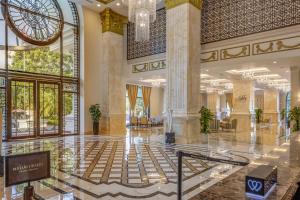 a lobby of a hotel with a large building at Meliá Vinpearl Tay Ninh in Tây Ninh