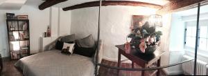a bedroom with a swing bed and a plant at Casa Livia in Lindau