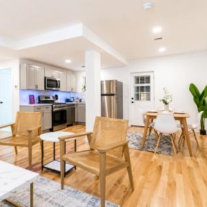 an open kitchen and dining room with a table and chairs at Charming 1-Bed Apt WiFi, Fully Equipped Kitchen in Rochester +18 photos