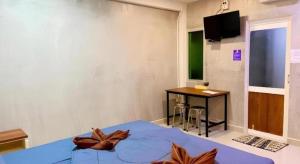a room with a bed and a table and a television at Kidthuengpark in Ban Nong Faep +61 photos