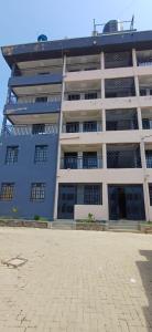 a large blue and white building with a lot of windows at Chateau Haven in Kakamega
