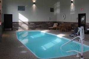 a large blue swimming pool in a room at Quality Inn Spearfish I-90 in Spearfish