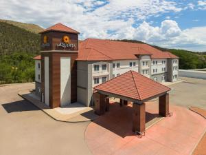 a rendering of a hotel with a pavilion in a parking lot at La Quinta by Wyndham Ruidoso Downs in Ruidoso Downs