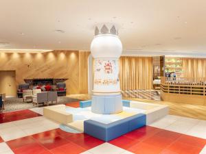 a lobby with a fountain in the middle of a room at Comfort Suites Tokyo Bay in Urayasu