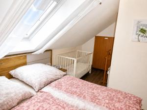 a bedroom with a bed and a skylight at Carmen u. Rudolf Lutz in Norddeich