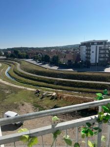 a view of a park with a building in the background at Stan na dan Ub in Ub