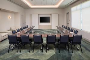 a large conference room with a long table and chairs at Hyatt House Destin in Destin +32 photos