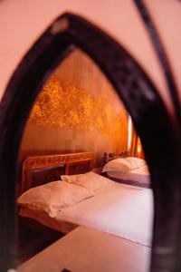 a bedroom with two beds and a mirror at JS Homestay in Nāgercoil +13 photos