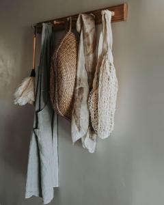 a group of bags hanging on a wall at Little Elizabeth in West Hobart +15 photos