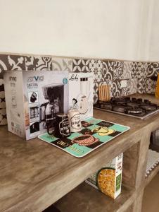 a counter top with a coffee maker and a box at Casa Imox in Bacalar +16 photos