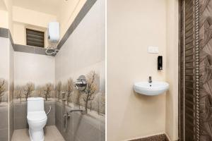 a bathroom with a toilet and a sink at Hotel O Visakhapatnam Railway Junction Formerly Kesava Residency in Visakhapatnam