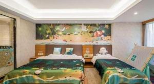 a bedroom with two beds and a painting on the wall at Oak Chateau in Jinzhou +247 photos