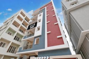 a tall building with a one way sign on it at Hotel O Madurawada Formerly IT Sez in Visakhapatnam