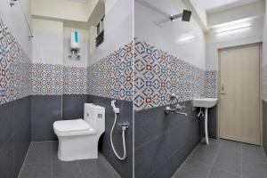 a bathroom with a toilet and a sink at Hotel O Madurawada Formerly IT Sez in Visakhapatnam +35 photos