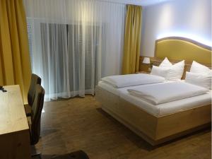 Voodi või voodid majutusasutuse Seminarhotel Daniels toas