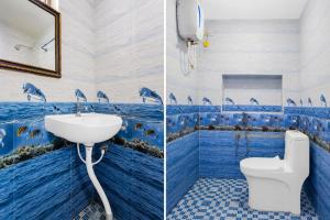 two pictures of a bathroom with dolphins painted on the walls at Collection O Anbu Nagar Coimbatore in Coimbatore +29 photos