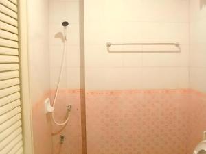 a shower with a glass door in a bathroom at Chanthanee Hotel in Ban Chamun (2) +87 photos