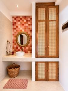 a bathroom with a sink and a mirror at Navi - Boutique Hotel - Adults Only in Ahangama +19 photos
