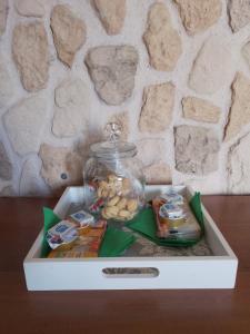 a white box with food in it on a table at La Casa di Anna'80 in SantʼArcangelo +14 photos