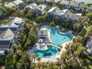 an aerial view of a pool at a resort at 3BR Golfside Villa | Pools, Tennis & Relaxation in Magenta