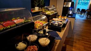 a buffet line with many different types of food at Pension Zeitlos in Potsdam +59 photos