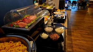 a buffet with many different types of food on display at Pension Zeitlos in Potsdam
