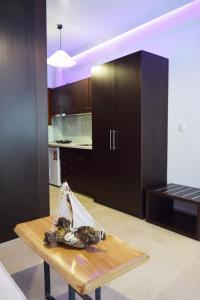 a kitchen with a wooden table in a room at Afytos Lofts in Afitos