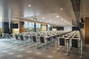 a large conference room with tables and chairs at DoubleTree By Hilton Istanbul - Moda in Istanbul +143 photos
