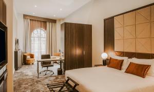 a hotel room with a bed and a desk at Doubletree By Hilton Wellington in Wellington