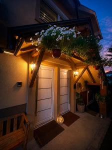a garage with a door with a flower arrangement on it at Naša Priča Silver Lake in Veliko Gradište
