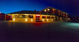 a building with lights on it at night at Beltway Motel and Suites in Halethorpe