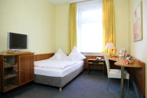Postel nebo postele na pokoji v ubytování TOP Hotel Amberger